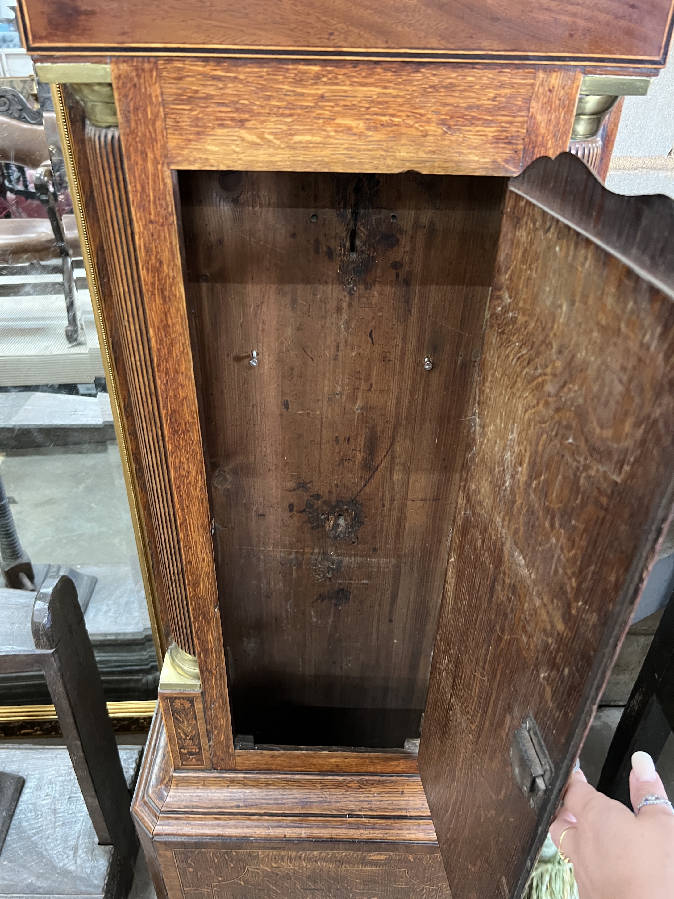 A late 18th century mahogany banded oak eight day longcase clock, with an arched painted dial marked Lanley, Wellington, height 228cm